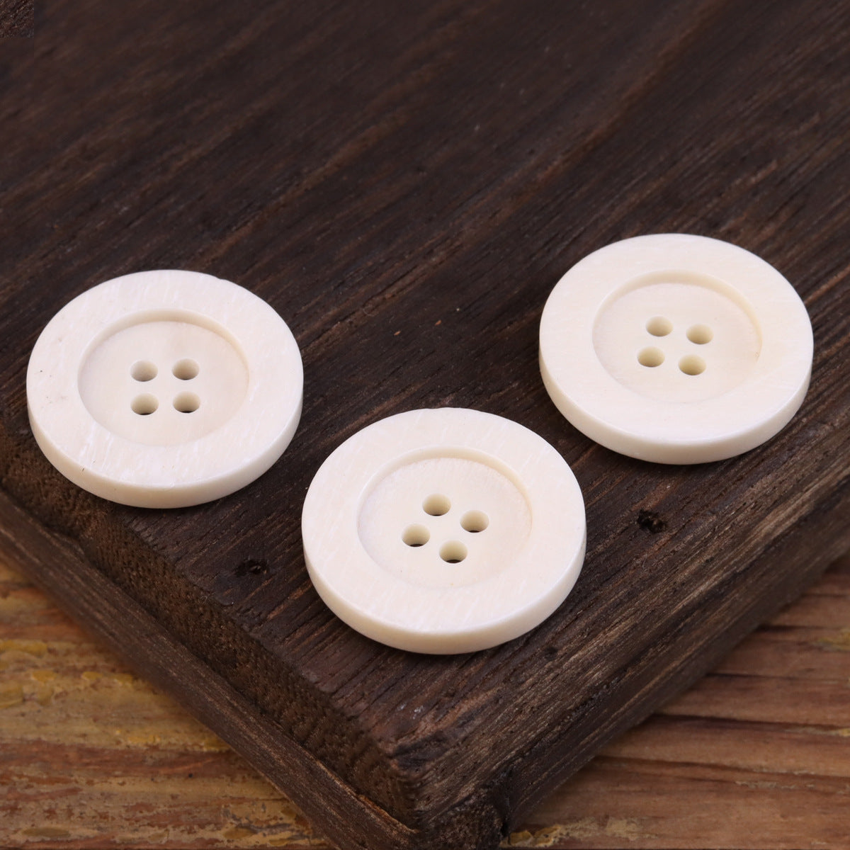 15-25mm Flat Wide-Edged 4 Hole Genuine Bovine Bone Buttons 20 Pack