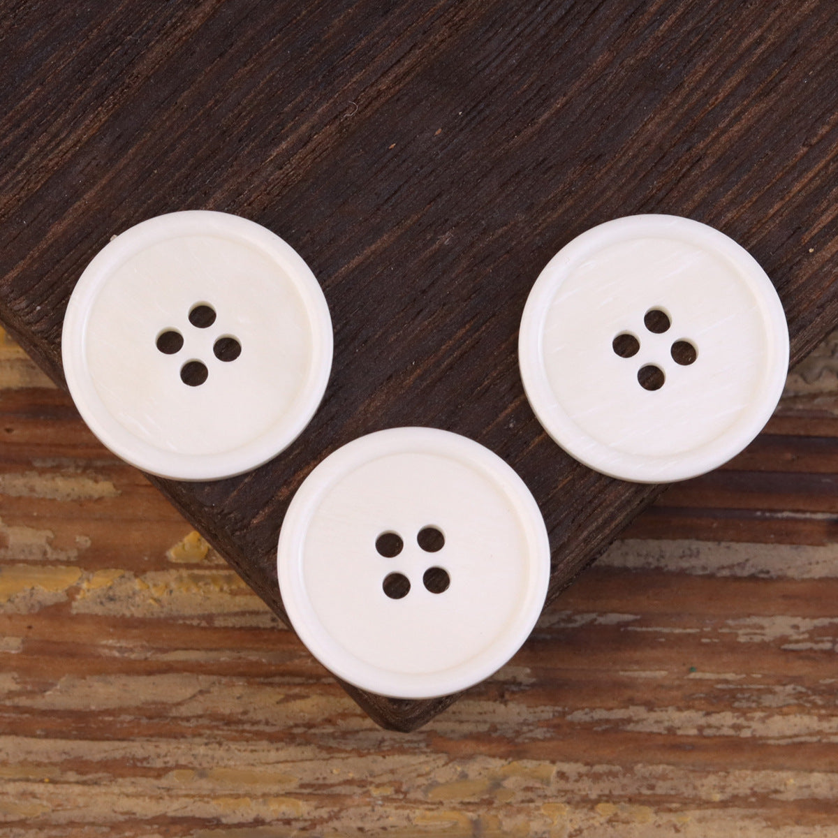 15-25mm Flat Wide-Edged 4 Hole Genuine Bovine Bone Buttons 20 Pack